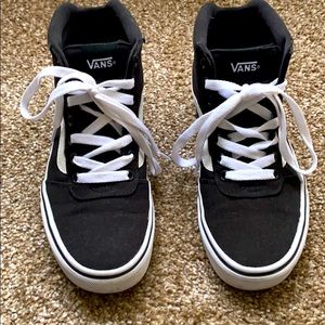 Black and white high top vans